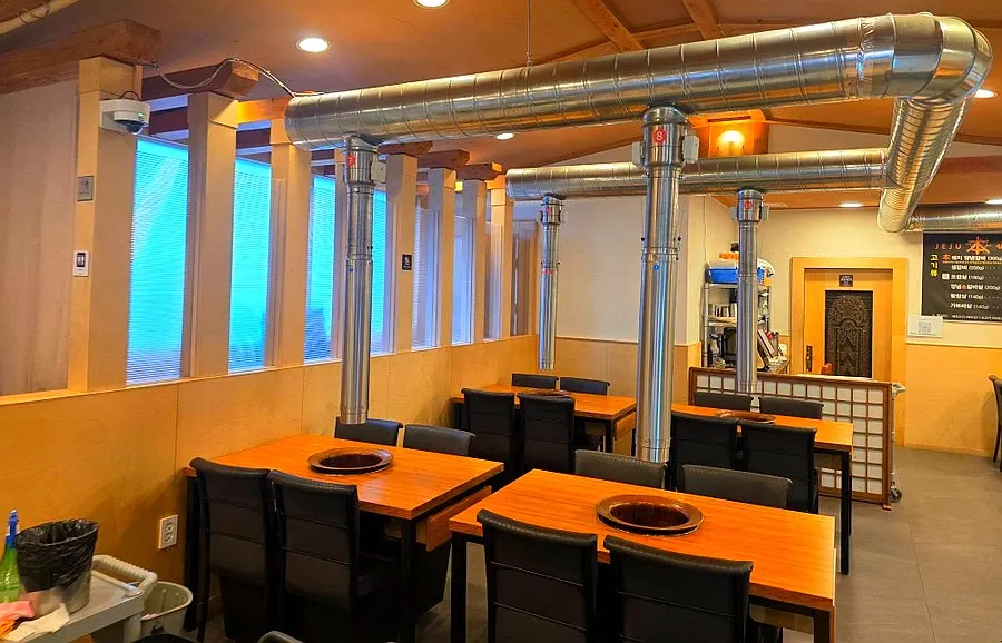 Restaurant interior with charcoal tables