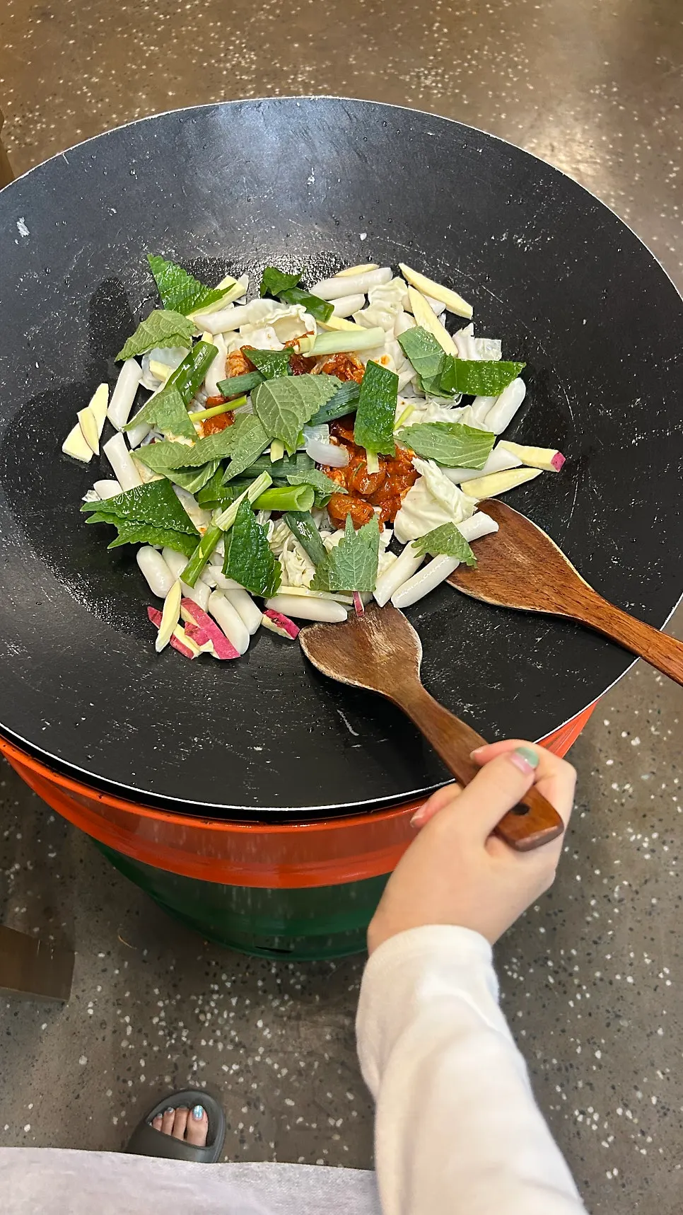 Raw dakgalbi and vegetables placed on the lid pot before cooking