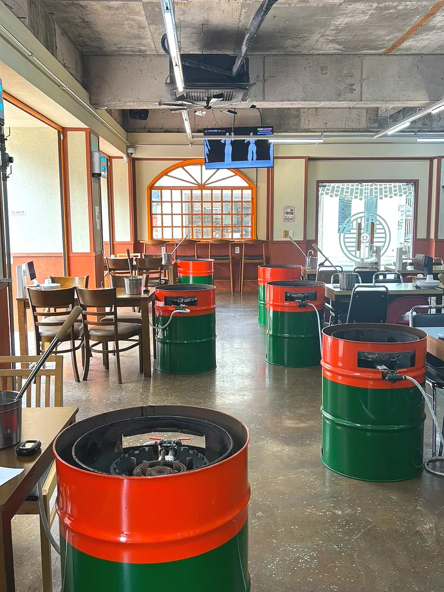 Interior of the restaurant with drum-barrel tables