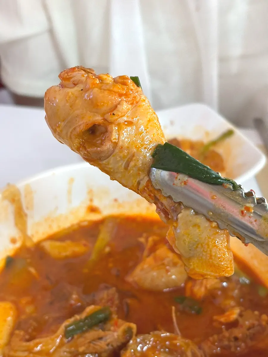 Chicken pieces deeply coated in dakdoritang seasoning