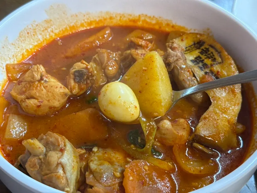 Chicken and potatoes soaked in seasoning