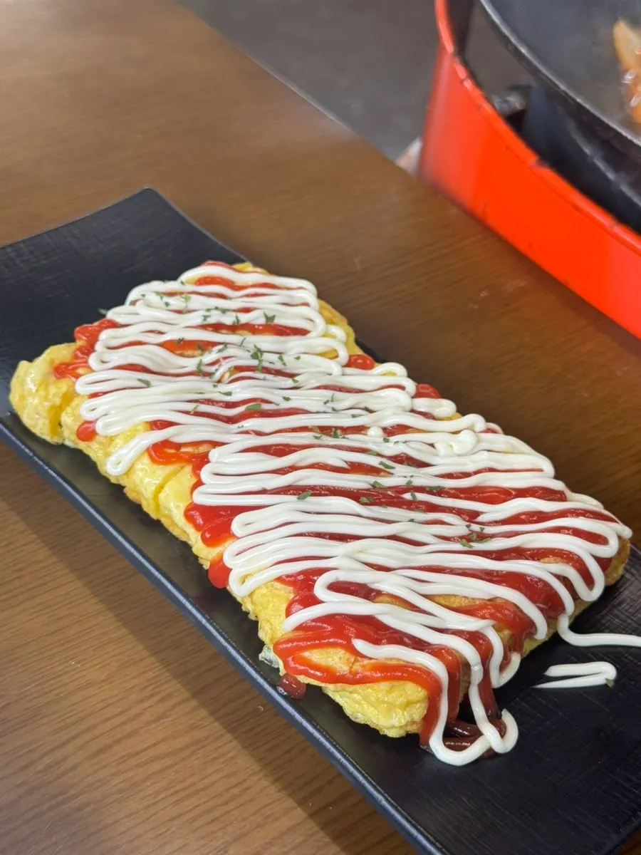 Egg roll slices served with dakdoritang