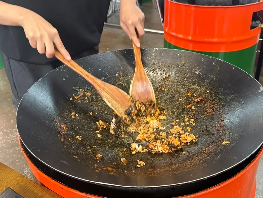 Table spread with leftover sauce in the iron lid