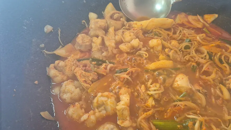 Beef tripe dakdoritang with chicken beneath bean sprouts