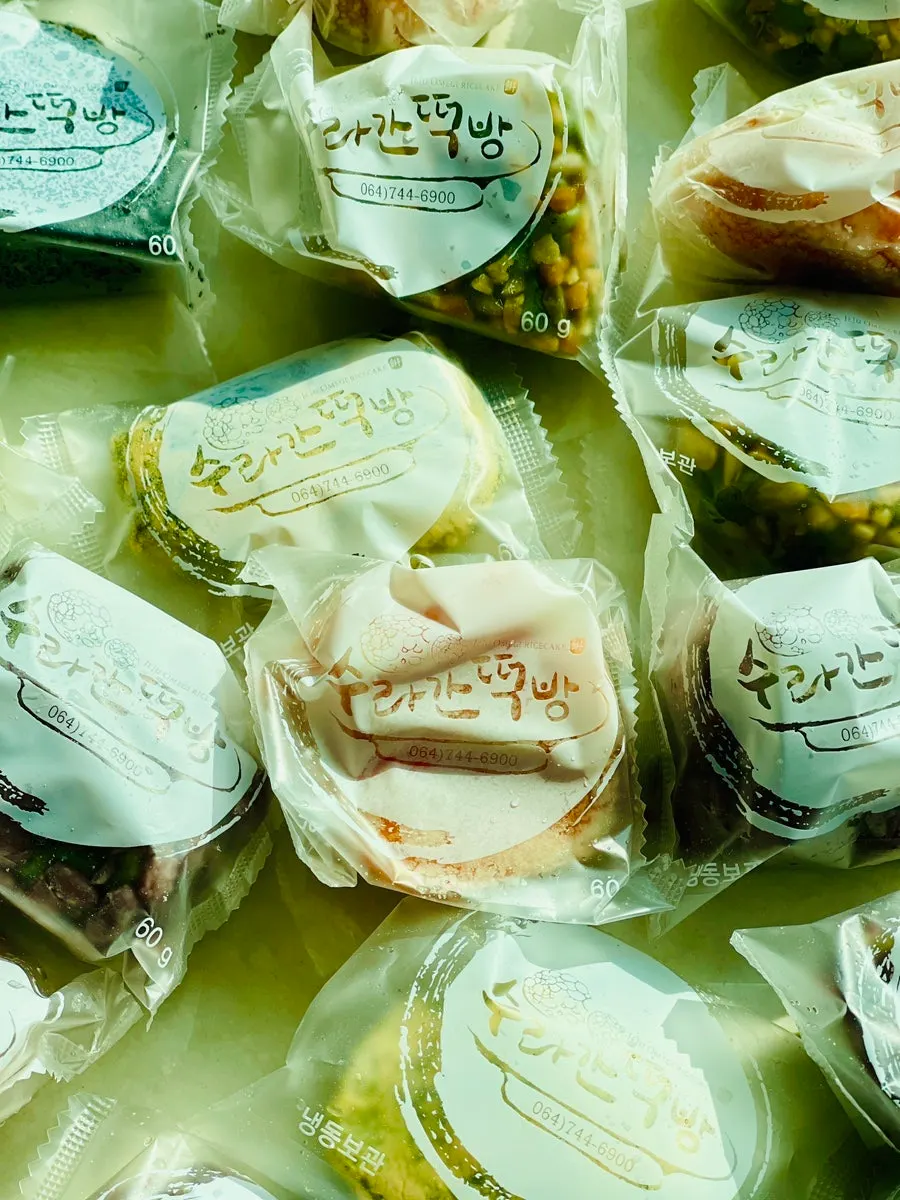 Box opened to reveal six flavors of omegi-tteok