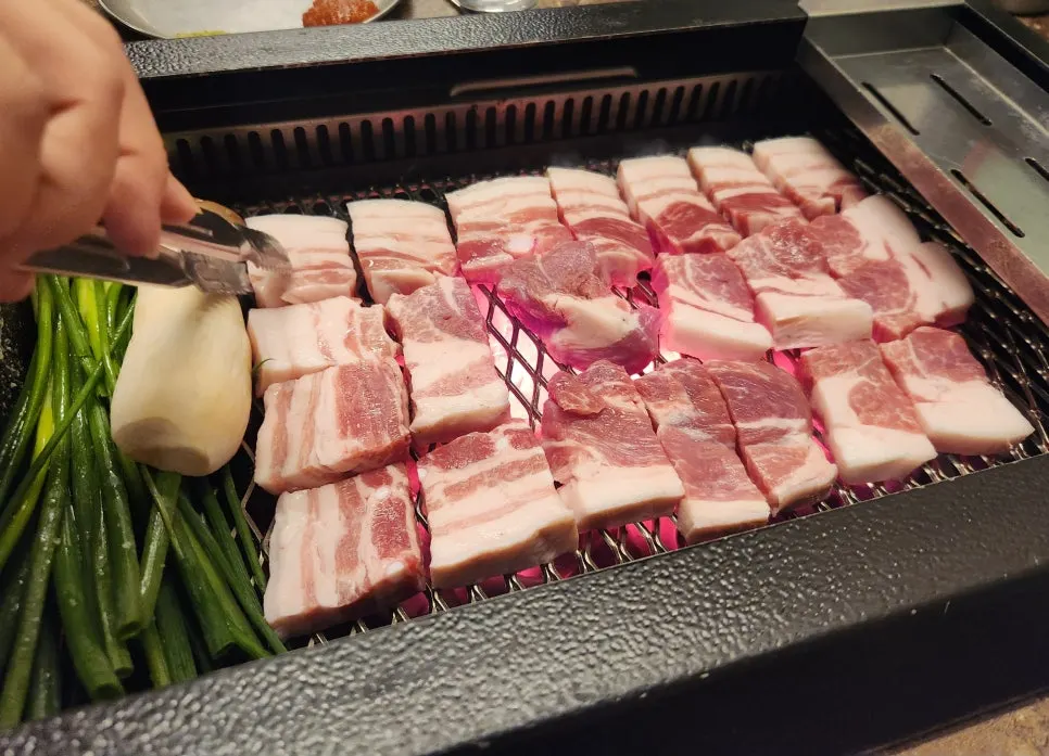 Staff grilling Jeju black pork