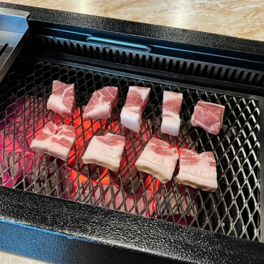 Raw pork belly and raw pork shoulder table setup at Pork80
