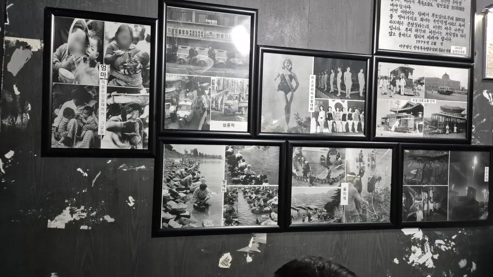 Black-and-white exhibit recreating an old Jeju market