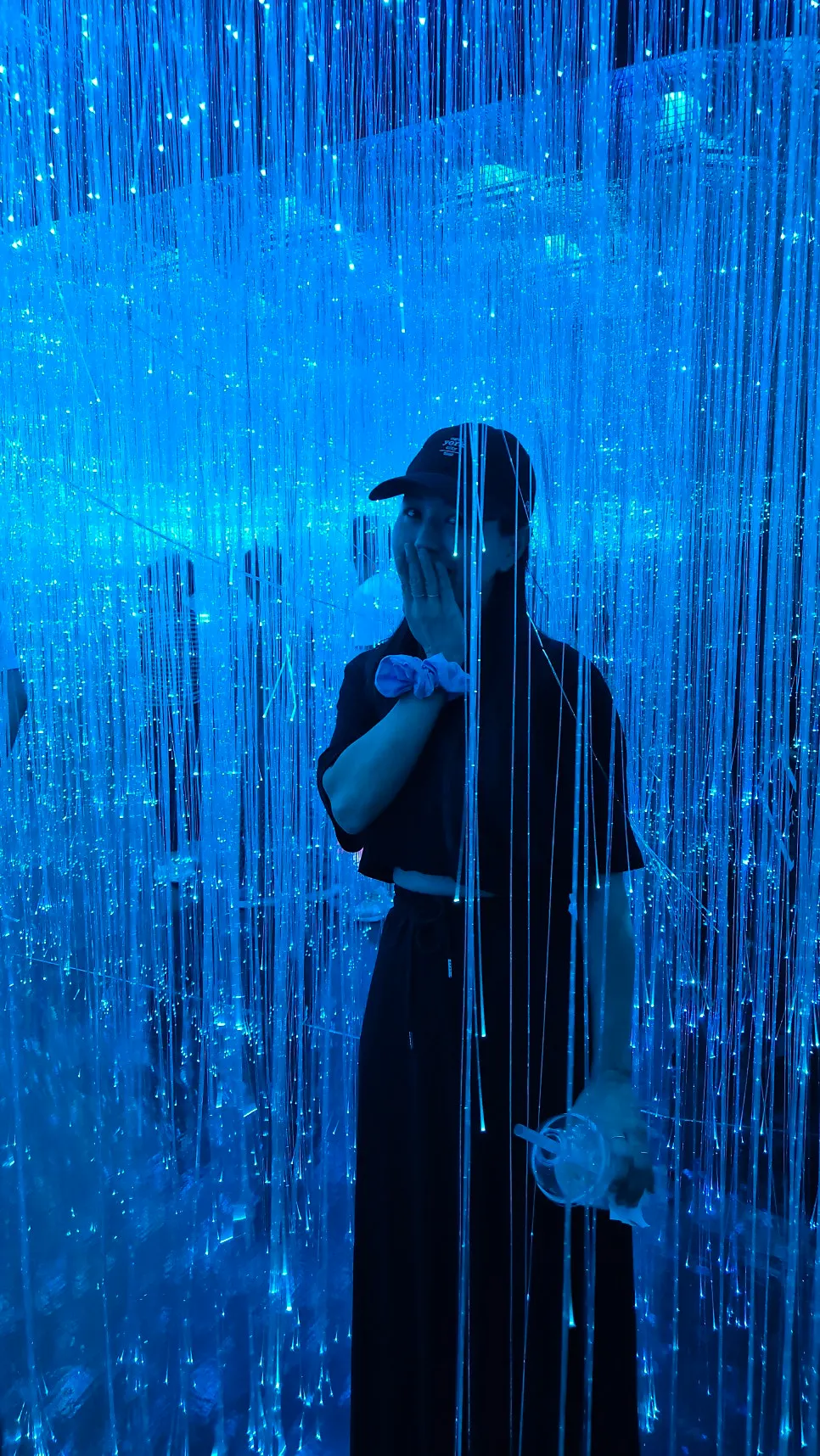 Dark exhibit passage using mirrors and lighting
