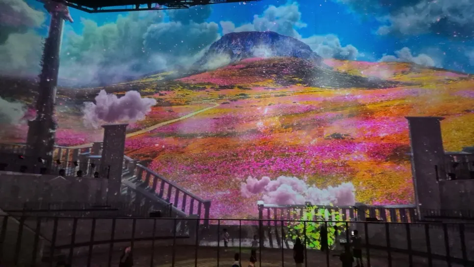 Media art video spread across the tall walls