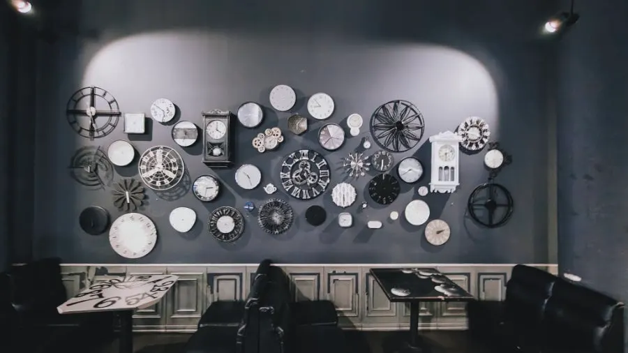 Vintage analog clock photo zone filling the café wall