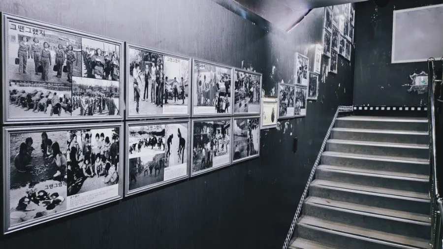 Staircase section lined with black-and-white vintage posters