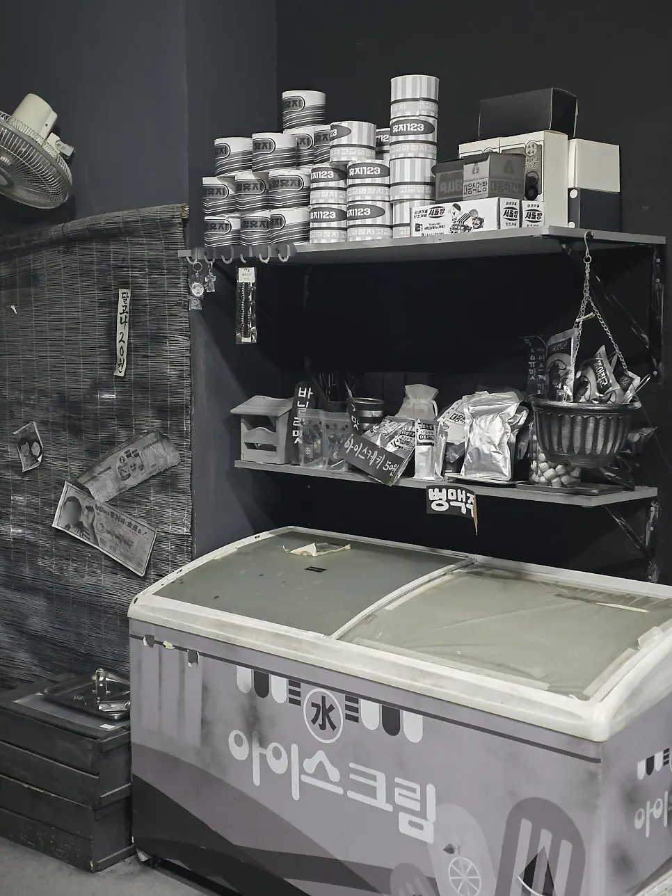 Interior of the black-and-white exhibition space at Nohyeong Supermarket