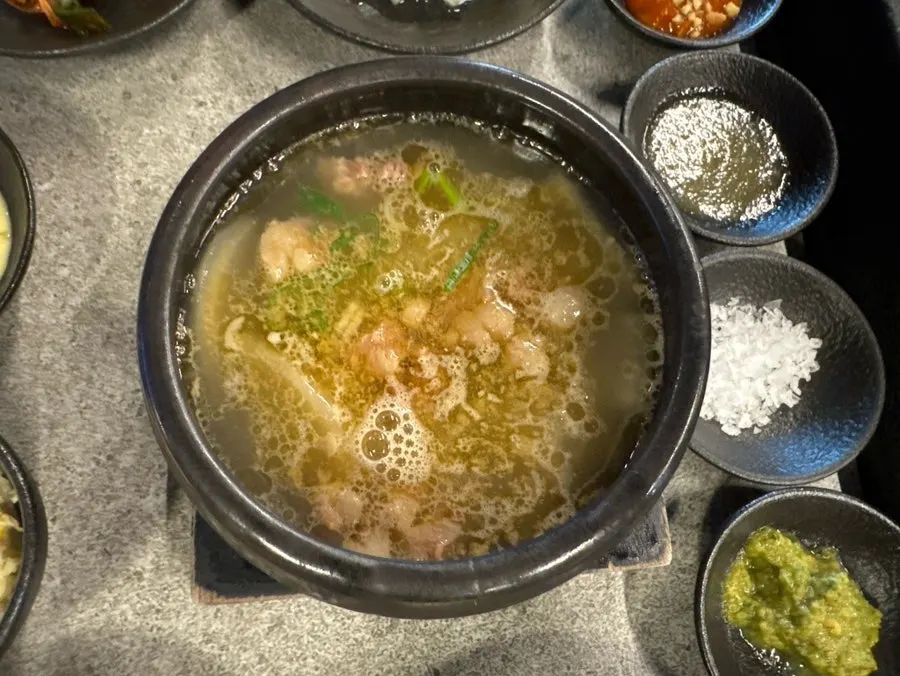 Basic beef soup served bubbling in a stone bowl