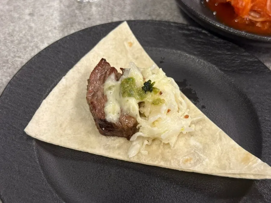 Udae galbi dipped in garlic sauce and wrapped in tortilla
