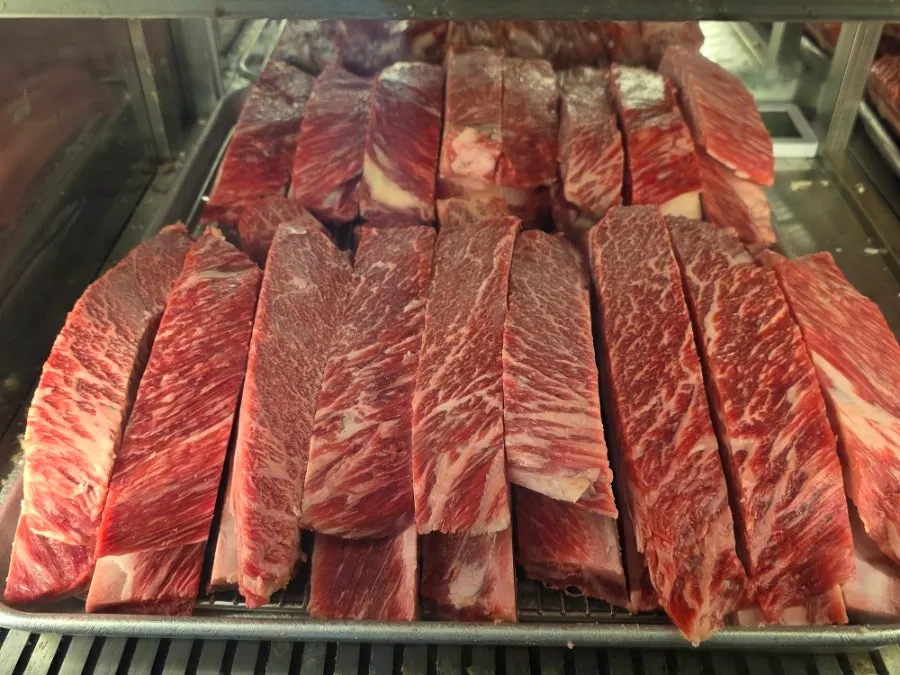 Staff grilling the meat all the way through tableside