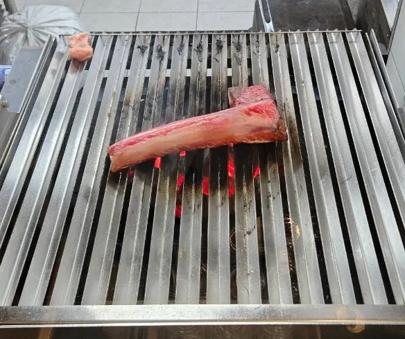 Straw being set alight to smoke the udae galbi