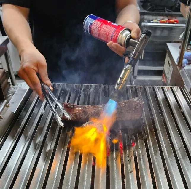 Smoke and flames from straw-smoking the udae galbi