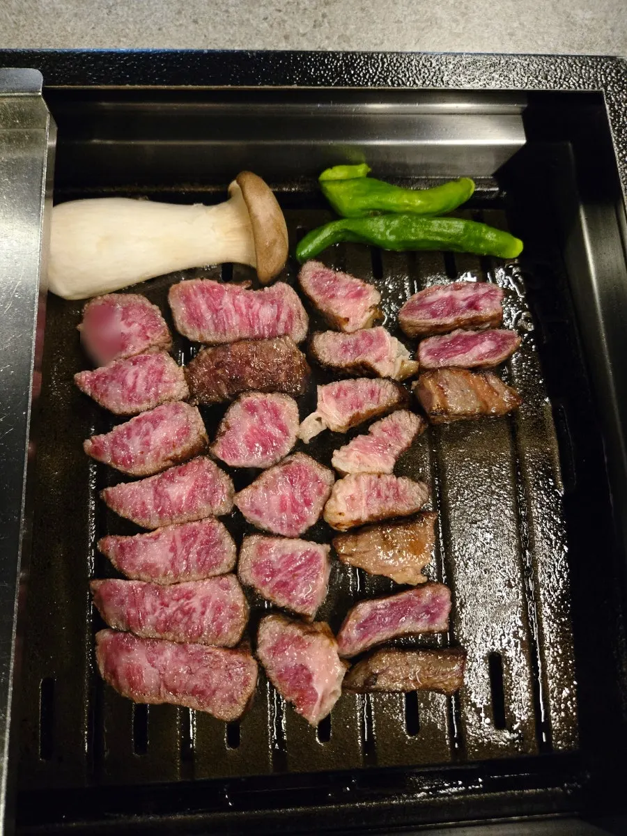 A piece of udae galbi dipped in salt