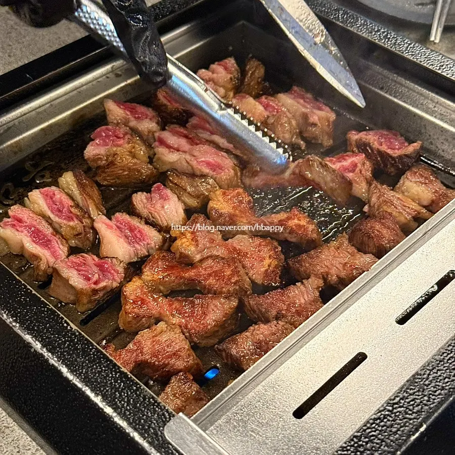 Staff grilling the udae galbi on the grill