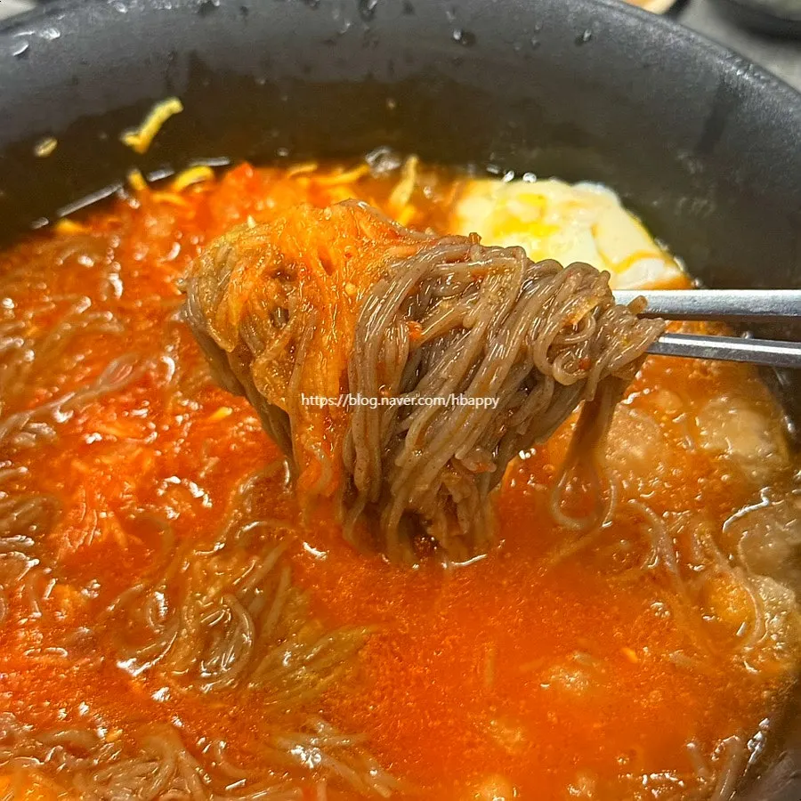 Naengmyeon topped with special seasoning sauce and radish salad