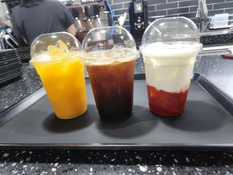 Sign showing the 5 drinks redeemable with the drink ticket