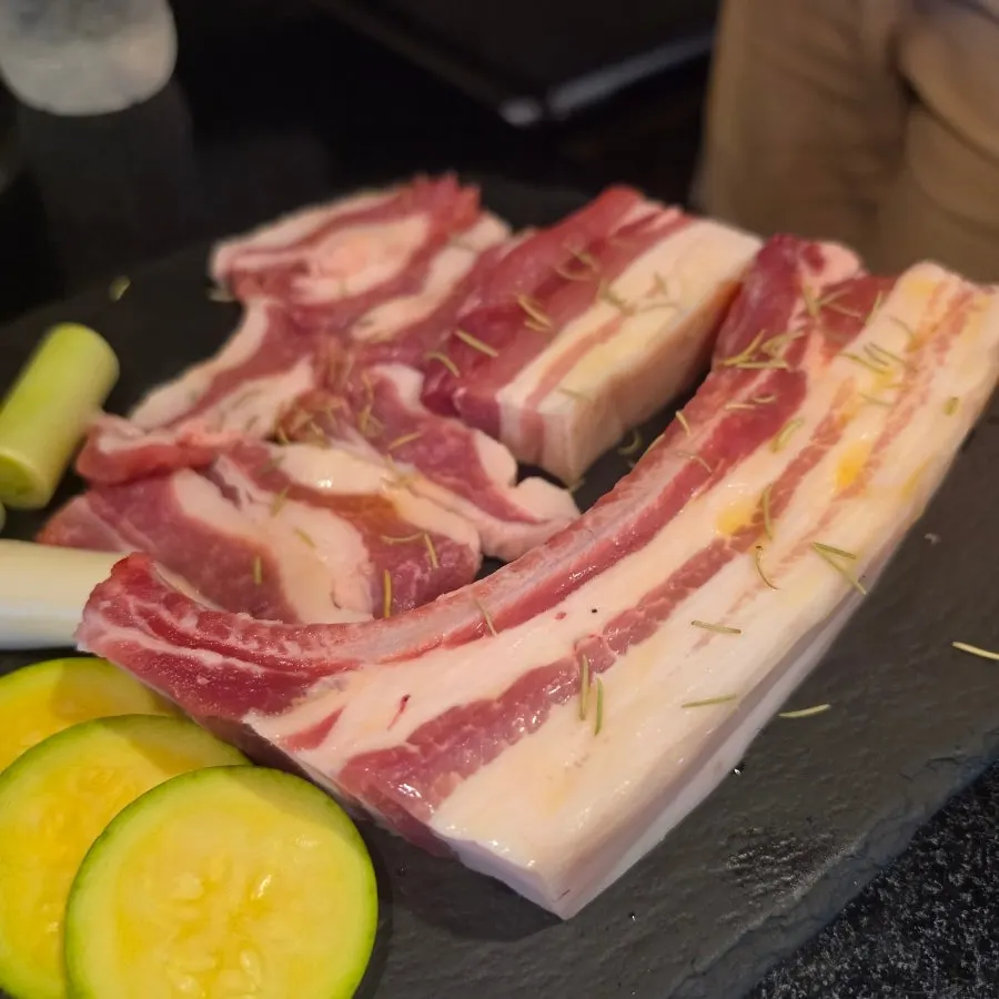 Black pork bonsamgyeop grilling on the pan
