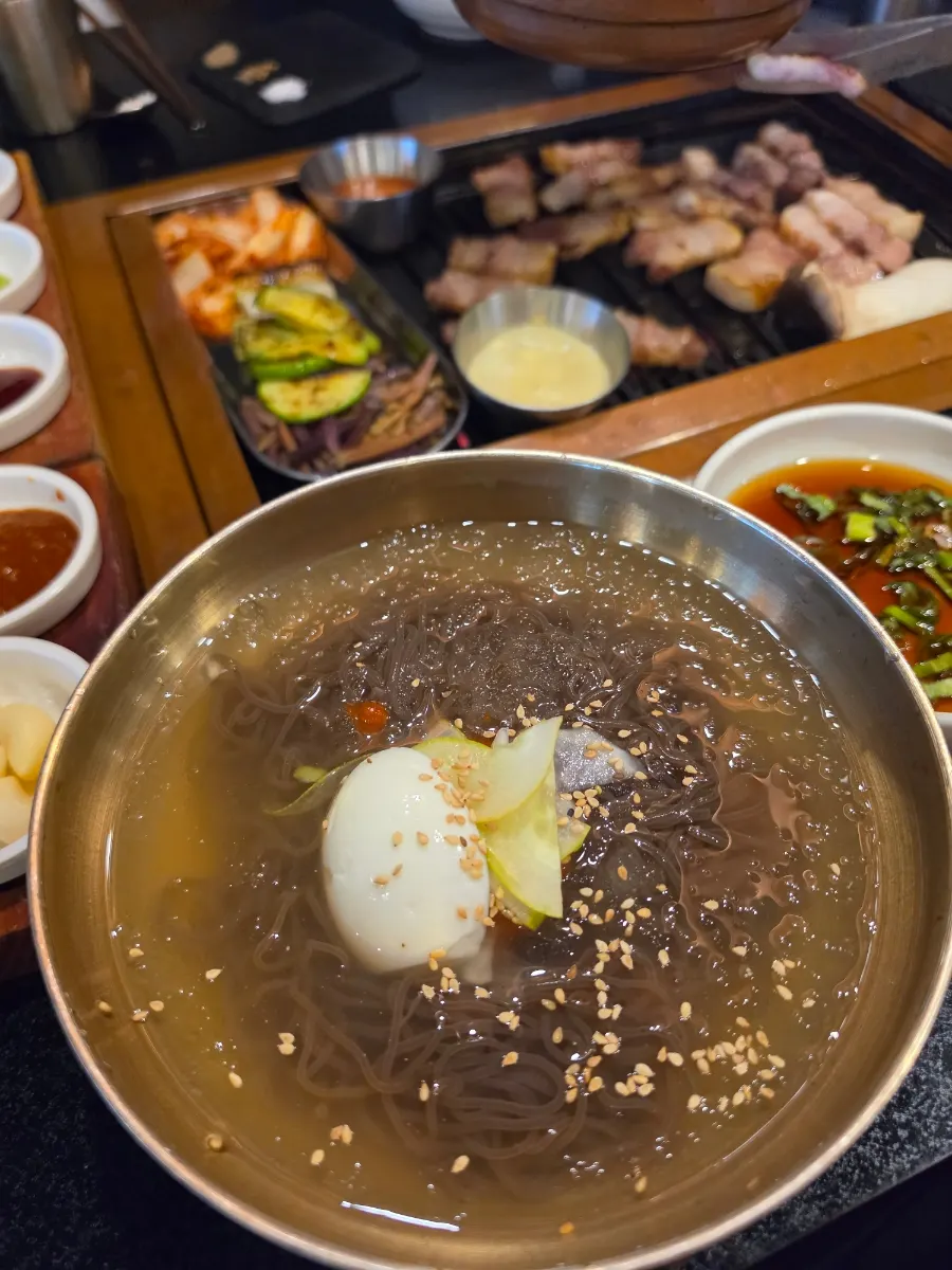 Cold noodle soup ordered alongside the meat
