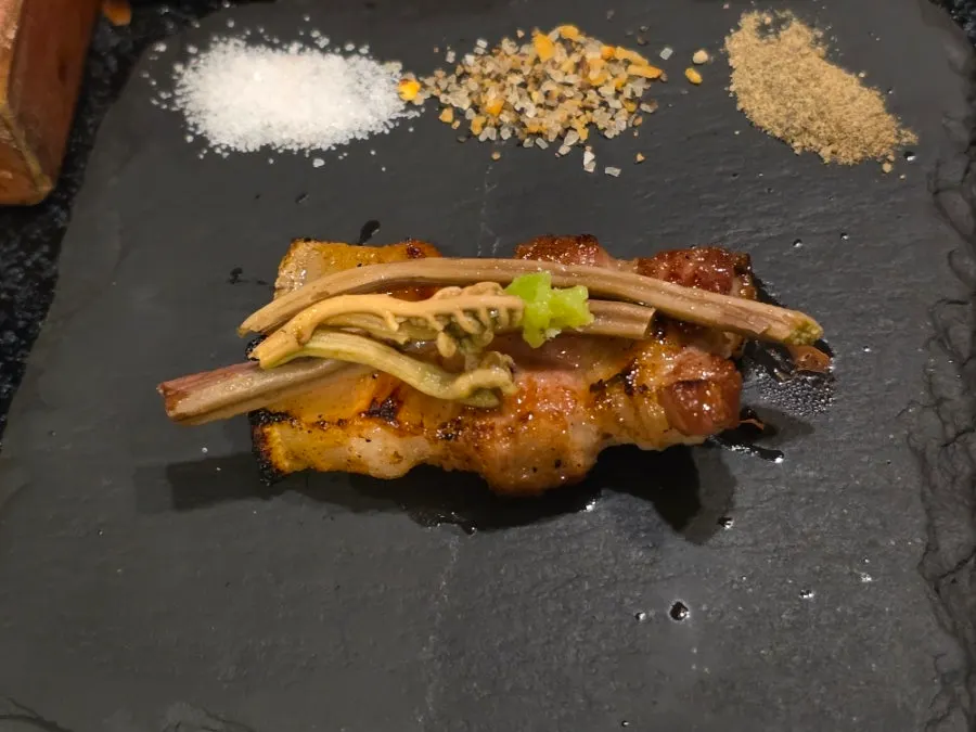Cross-aged black pork dipped in sauce