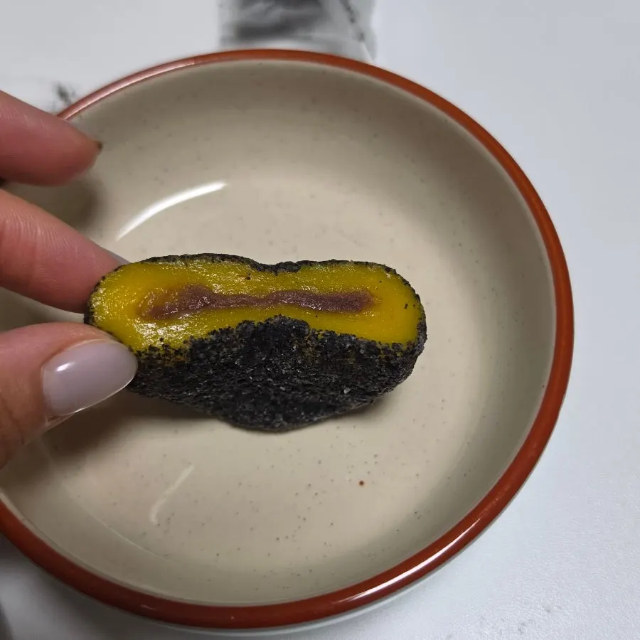 Black sesame omegi-tteok sliced in half