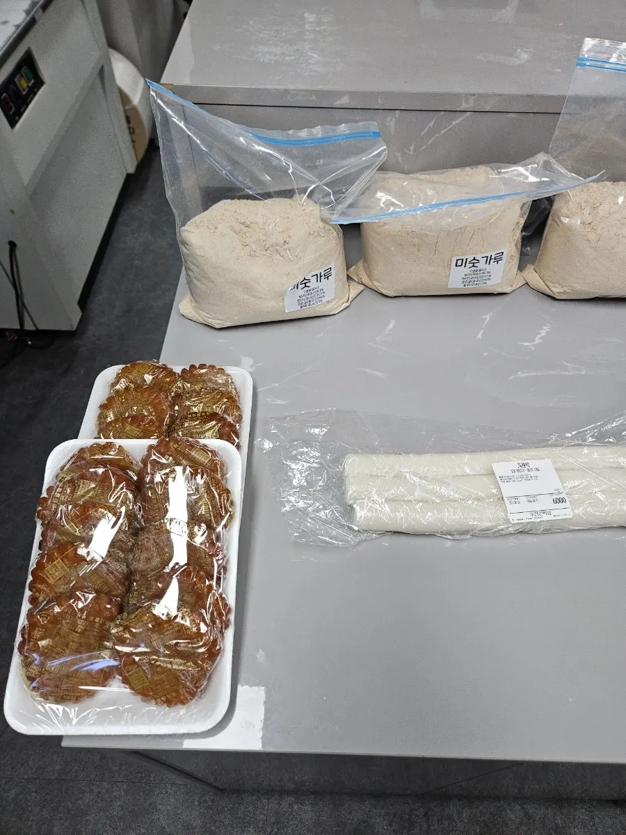 Assorted rice cakes on display besides omegi-tteok