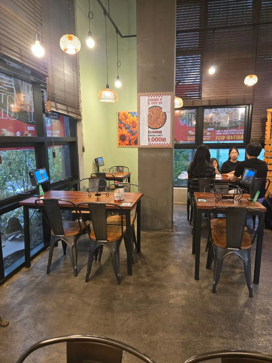 Open kitchen visible inside Happiness Pizza