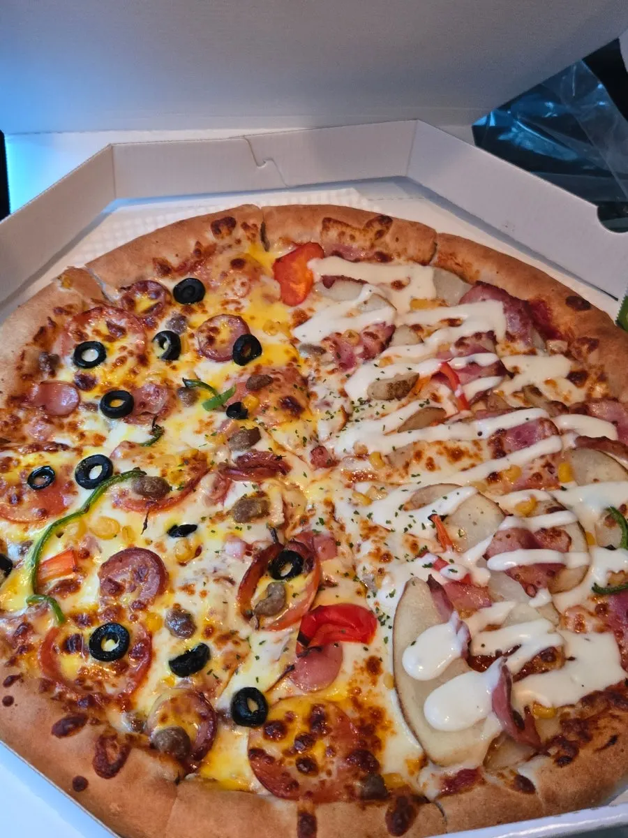 Picked-up pizza and party food spread