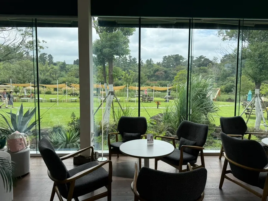 Interior of PLANT827 café with floor-to-ceiling windows on every side