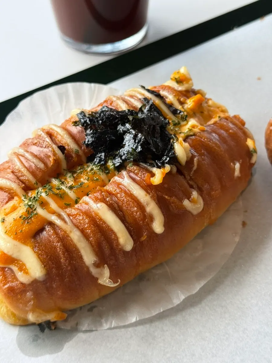 Fruit cream bun and mentaiko baguette on the table