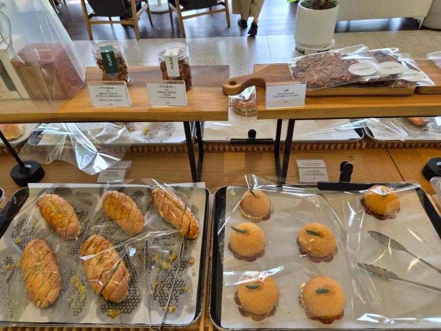 Chocolate scone, sweet potato bread, and chewy cream roll on display