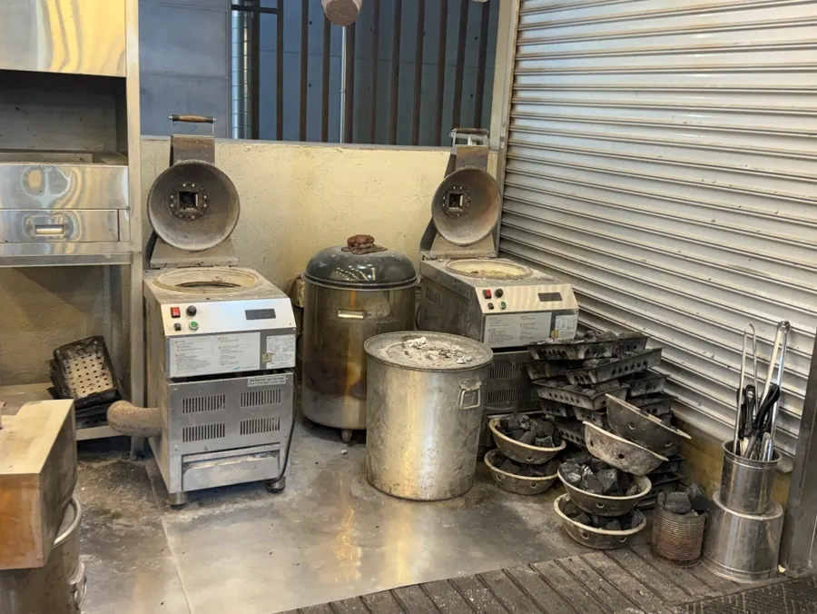 Charcoal prep visible from the entrance