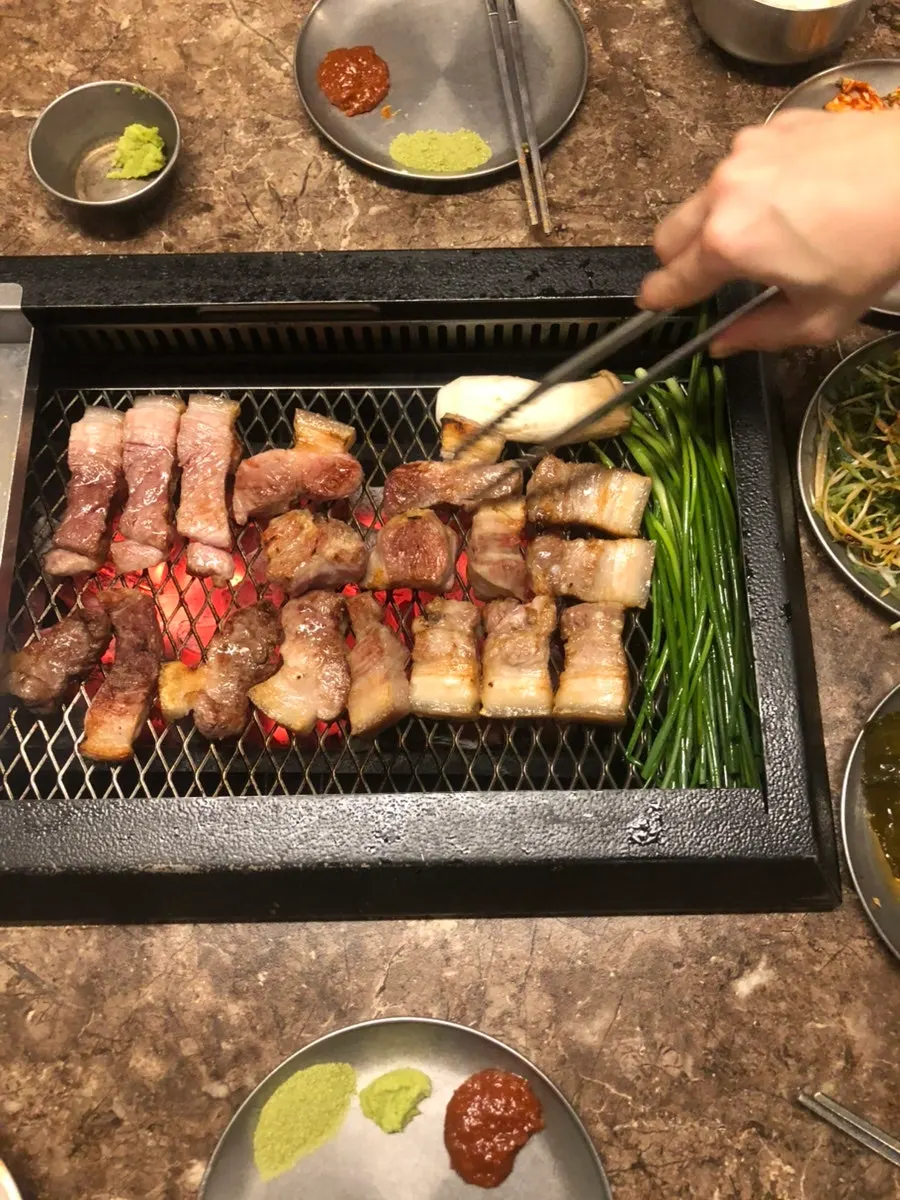 Mushrooms grilled in meat fat alongside the pork