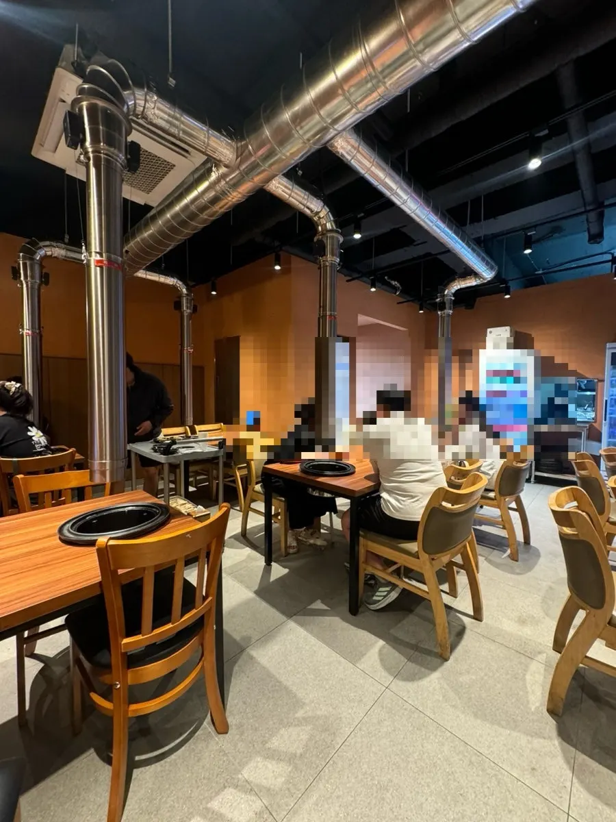 Full view of seating inside Jeju Samchun black pork restaurant