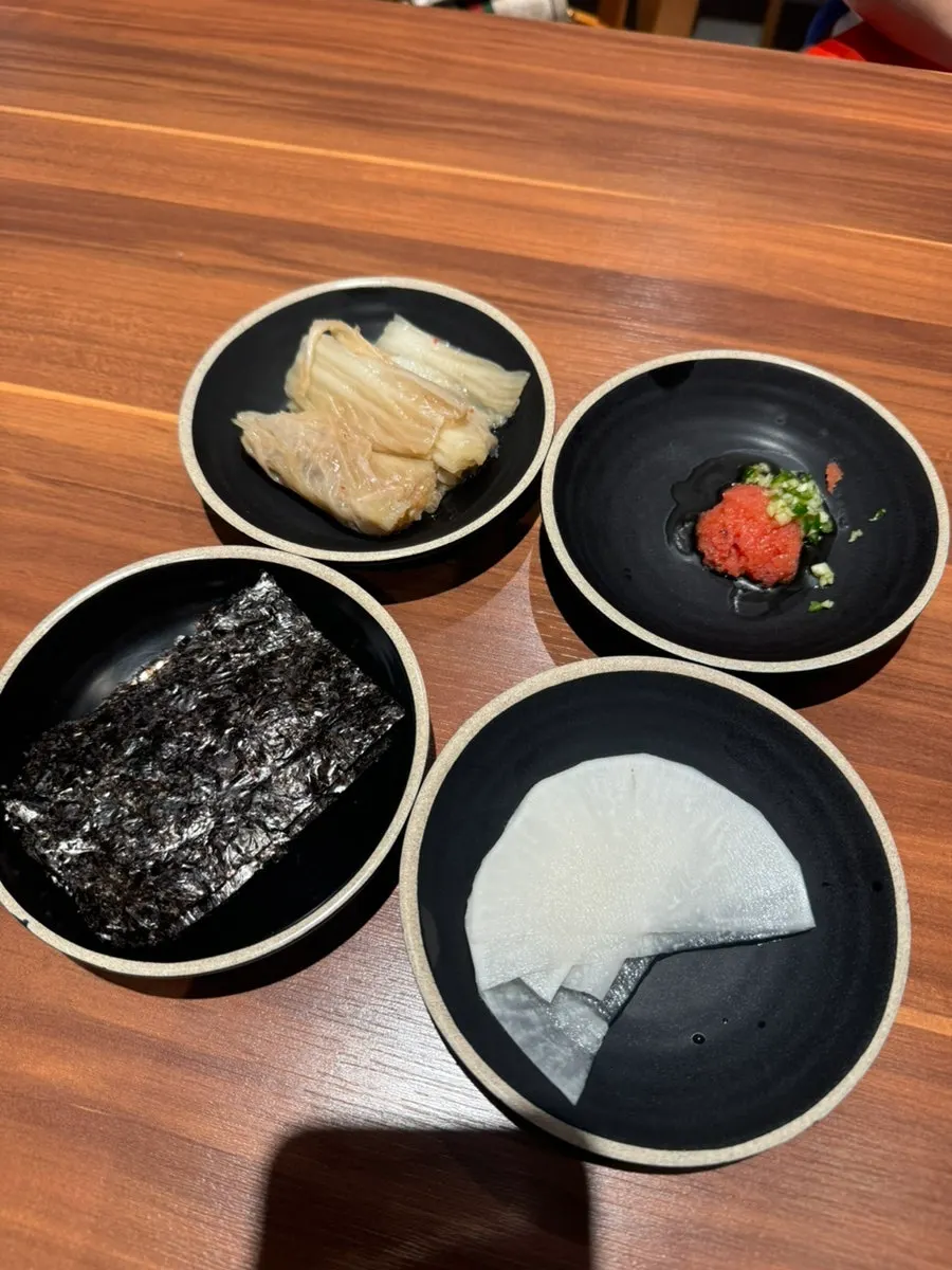 Basic table setup served alongside the black pork