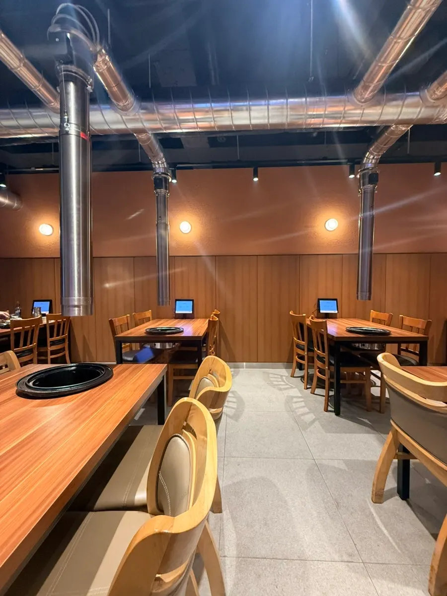 Interior with connected 4-person tables near the entrance