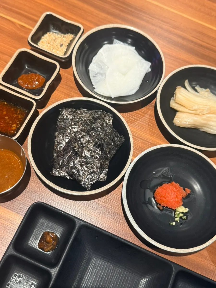 Scallion salad and cucumber salad among the banchan