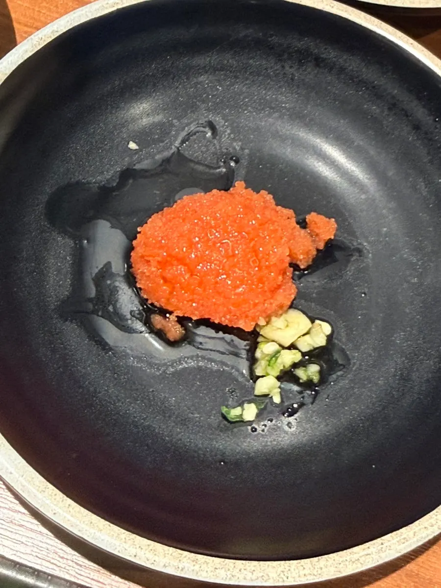 Breadcrumb salt and myeongran served alongside the meat
