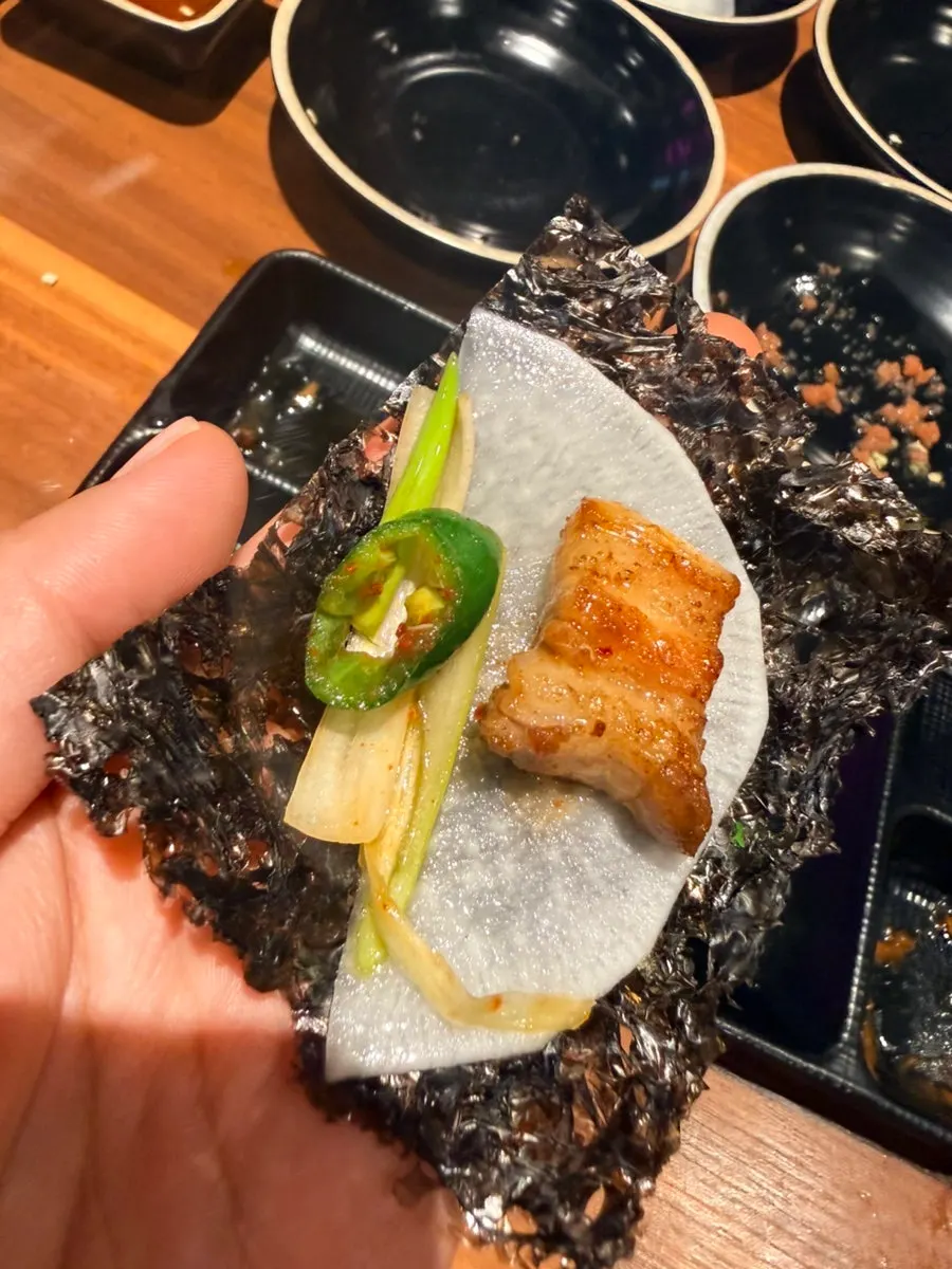 Nearly empty grill plate with leftover wrap vegetables
