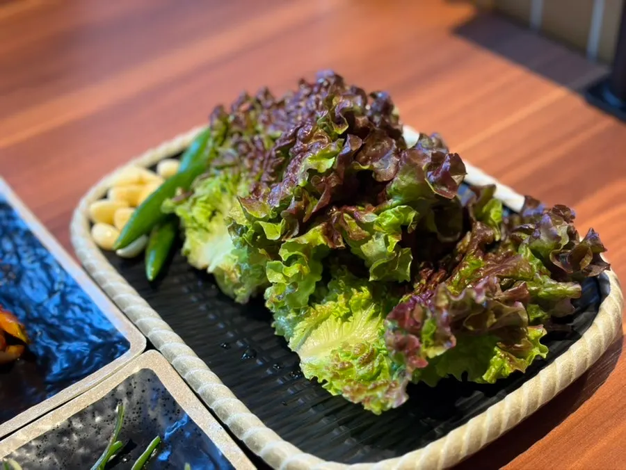 Basic side dishes with cucumber salad, scallion salad, pollack roe, and greens
