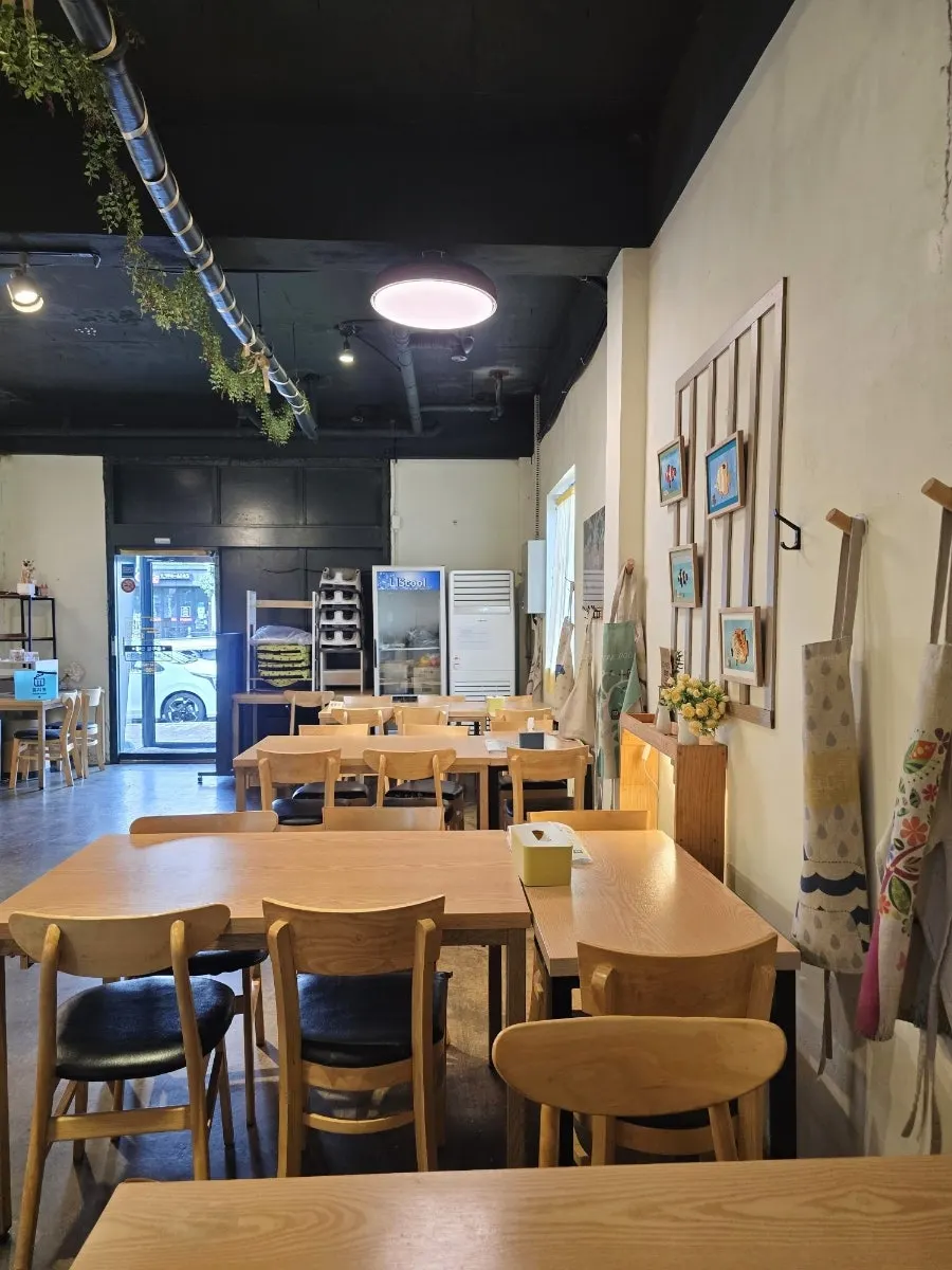 A corner of the restaurant with soft lighting and emotional frames