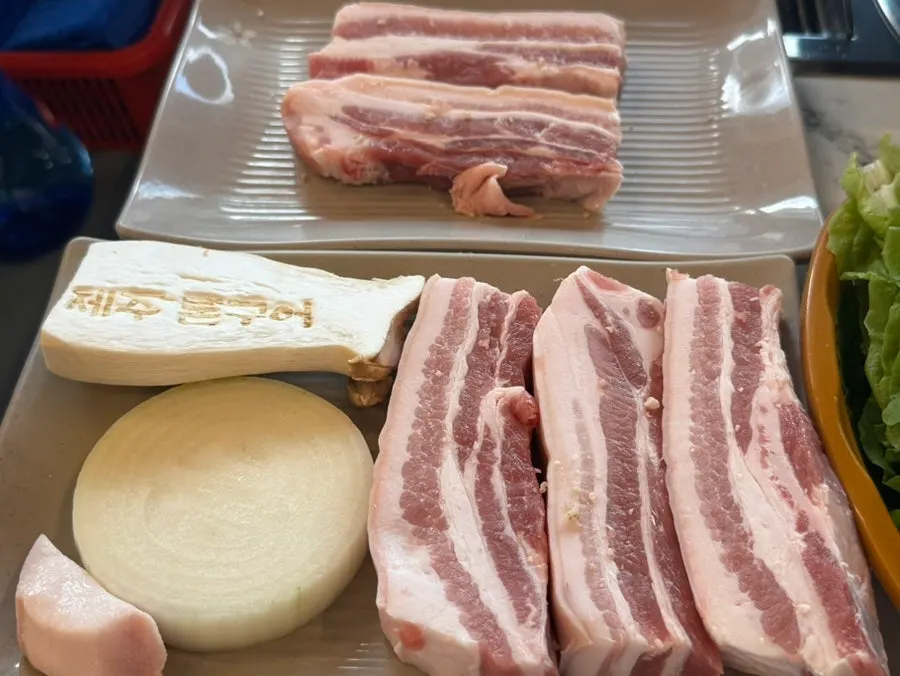 Table setting with side dishes, grilled cheese, and steamed egg