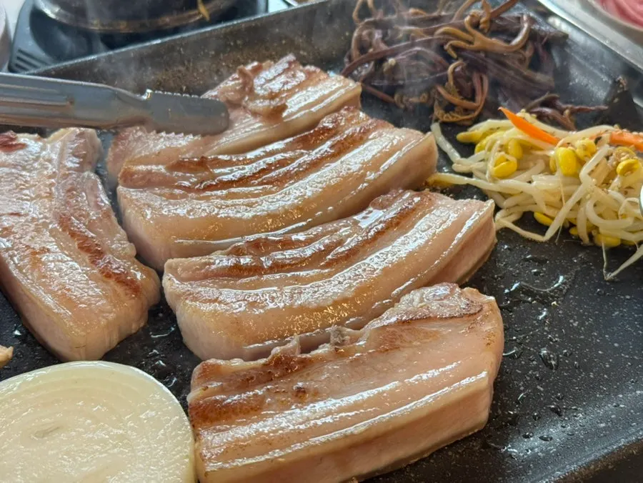 Black pork belly grilling on the pan