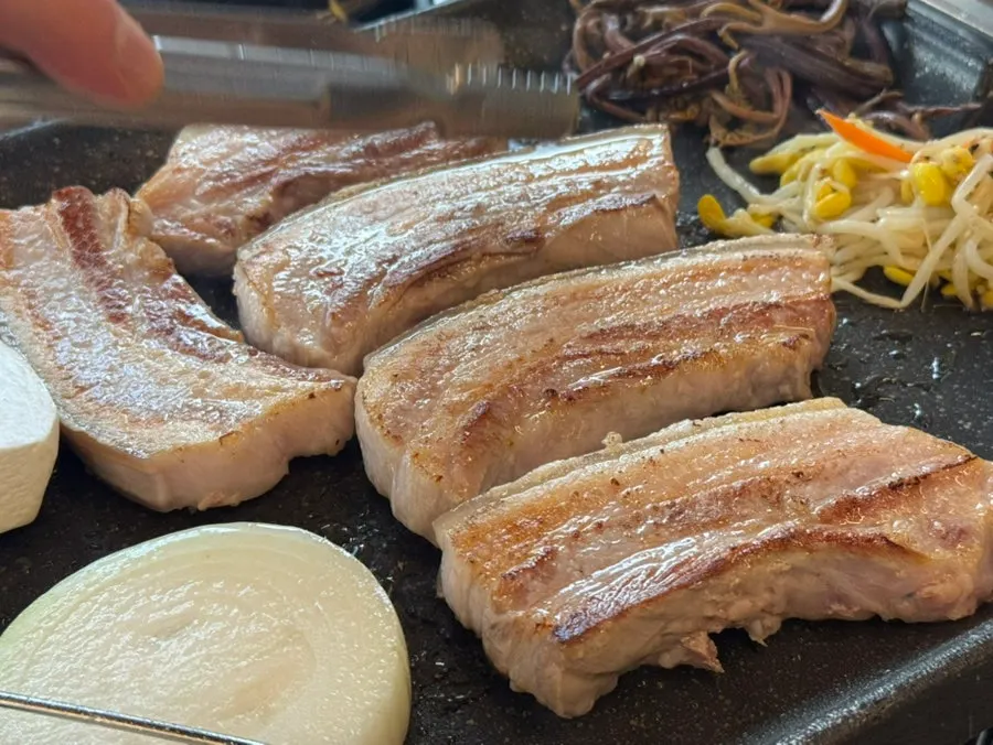 Firm, well-grilled black pork meat