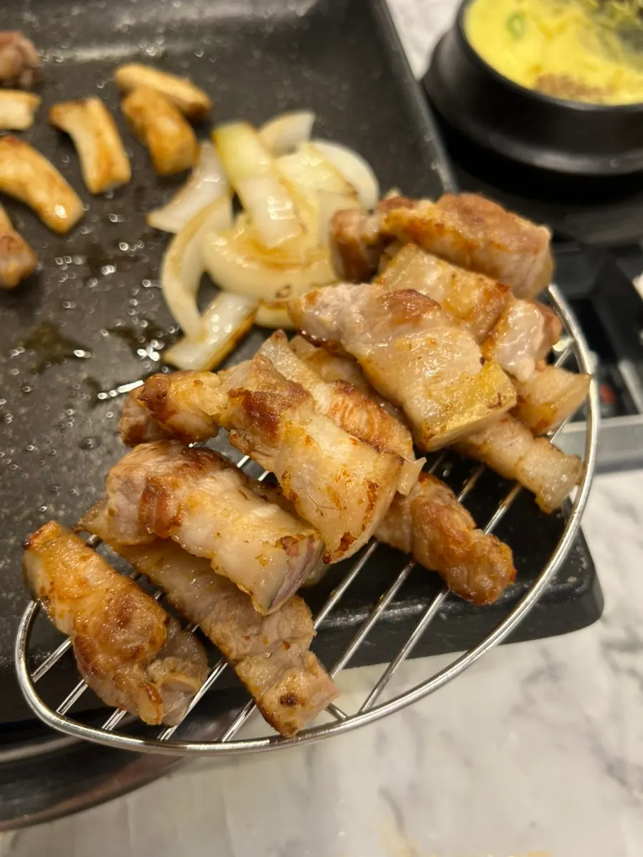Golden-brown grilled black pork belly